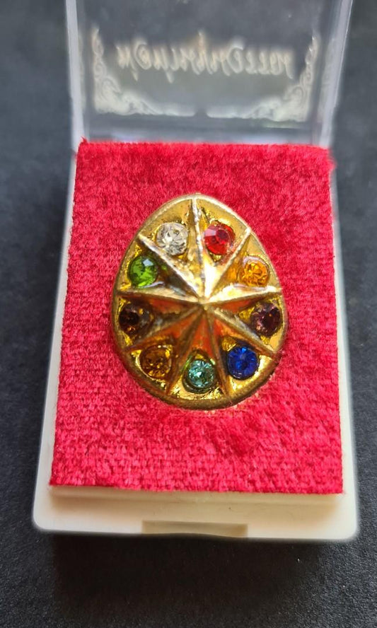 The Nine-Faced Lucky Star & Celestial Eye (BE 2560) The Beacon of Wisdom and the Shield of Fortune